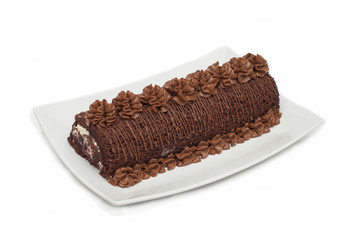 Tasty Chocolate Cake Isolated on White. Homemade Cake in white long Plate. Dessert.