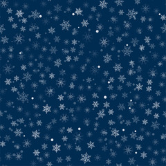 abstract Christmas seamless pattern from white snowflakes on a blue background. For holiday, new year, celebration, party.