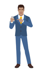 Businessman pointing at a mobile phone