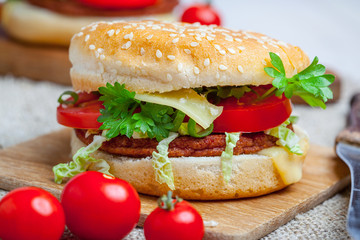 Homemade hamburger with fresh vegetables.