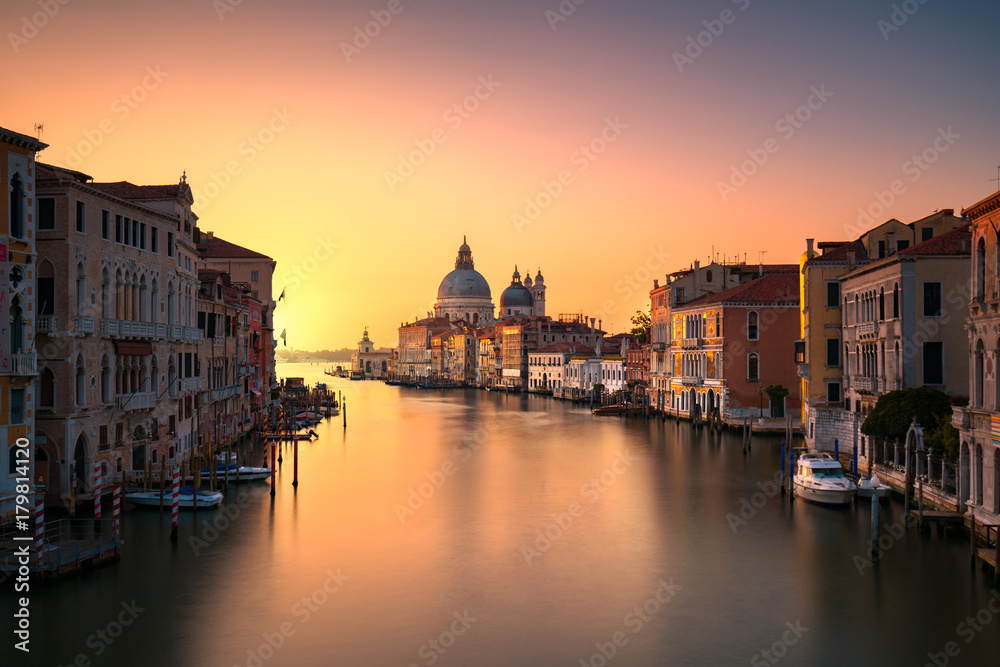 Wall mural Venice grand canal, Santa Maria della Salute church landmark at sunrise. Italy