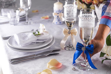 the woman is holding a glass in her hand