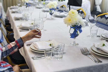 the woman is holding a glass in her hand