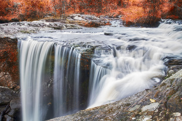 Autumn waterfall in deep forest