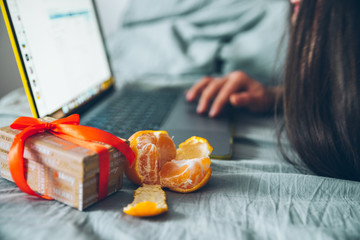 christmas present with mandarines in bed