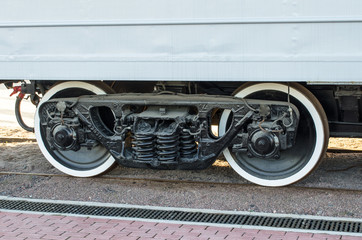 Wheels of a train a carriage, wheels with a white rim.