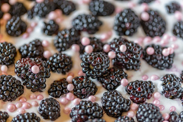 Cake and sweetness background. Fresh fruit and candy on the cake