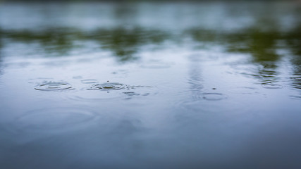 Rain and water droplets on water surface