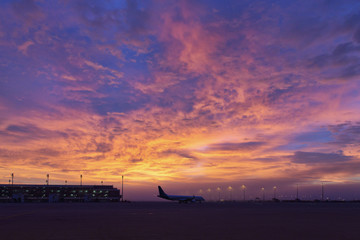 airplan taxiing infront of majestic morning sky