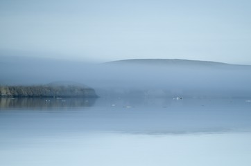 The coast of the arctic island in the fog
