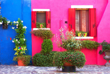 Fototapeta na wymiar Colourfully painted house facade on Burano island, province of Venice, Italy