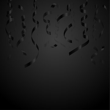 Black serpentine and confetti on a black background.