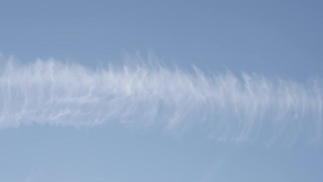 Artificial clouds remains from chemtrails behind aircraft footage - Water-based contrails produced by engine exhaust