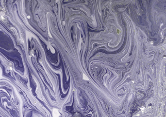 Marbled purple abstract background with golden sequins. Liquid marble ink pattern.