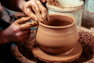 Potter at work. Workshop.