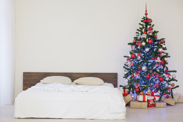decor white bedroom with Christmas tree Christmas gifts