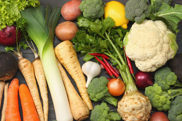 Fresh vegetables on dark wooden background. Mockup for menu or recipe. Top view