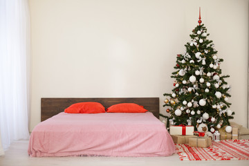 bedroom with Christmas new year tree decoration bed