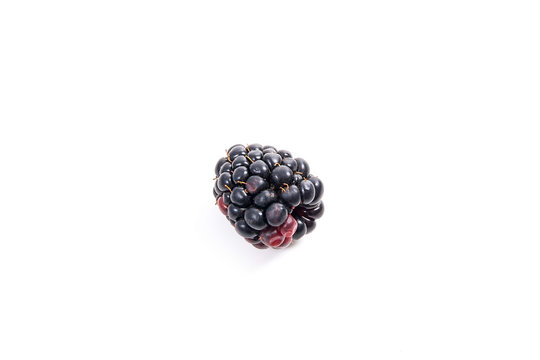 Ripe blackberry fruit isolated on white background.