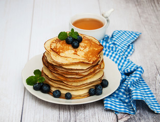 Plate with pancakes and blueberries