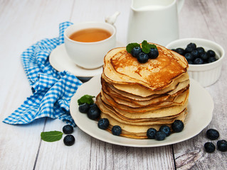 Plate with pancakes and blueberries