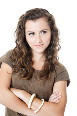 skeptical young woman with crosssed hands isolated