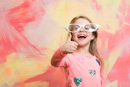 Happy Girl In Funny Eyeglasses Giving Thumbs Up