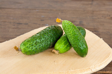 Cucumbers on a wooden background..