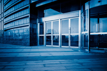 empty pavement front of the modern office entrance.