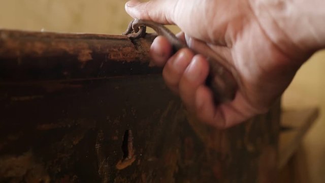 Hand opens weathered dusty furniture slow motion footage - Wooden chest opening slow-mo