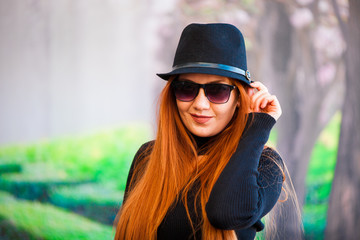 Beautiful girl drinking coffee at the coffee shop