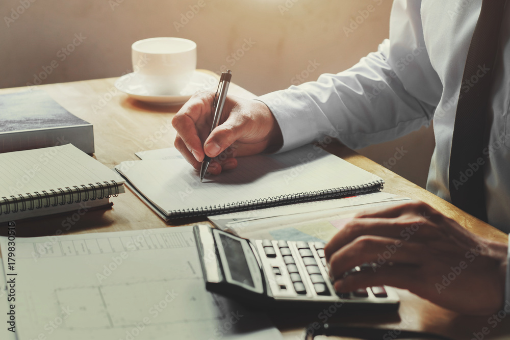 Poster accountant working on desk office with using a calculator and pen, finance accounting concept
