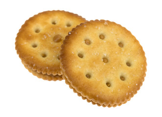 Two roasted peanut butter crackers isolated on a white background.