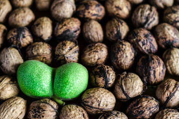 a lot of textured peeled walnuts and one double green