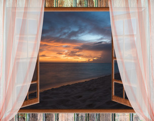 view from the open window of the caribbean sunset