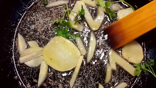 fry potatoes in a frying pan in the form of number 2018.