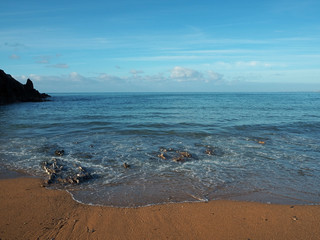 beautiful blue sea lapping Hope Cove beach