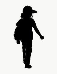 Silhouette of a walking child in a cap and with a backpack