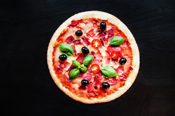 Raw dough pizza with ingredients.  Fresh italian classic original pepperoni pizza