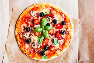 Hot pizza slice with Pepperoni, cheese, mozzarella and tomato  on a rustic background  close up. .