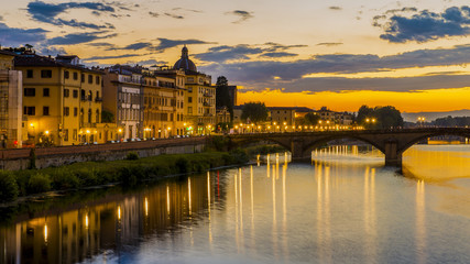 Fototapeta na wymiar Florence cityscape view with Ponte Vecchio, a medieval stone bridge over Arno River.