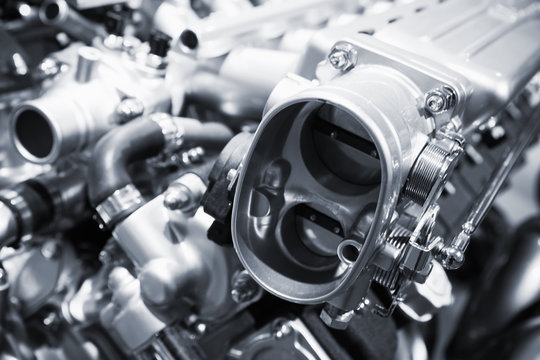 Shiny motor parts, V12 engine, closeup photo