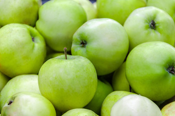 a lot of green apples on the whole frame