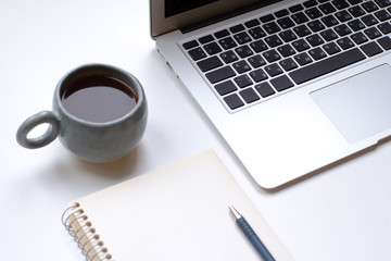 notebook on white table with gadgets and decorations, top view of writer, freelancer or buisinessman work place 