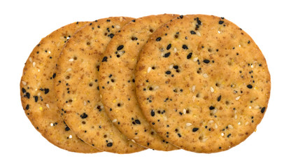 A short row of multi grain baked crackers isolated on a white background.