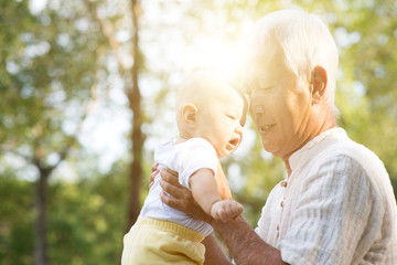 Fototapeta premium Grandfather and grandson outdoors.