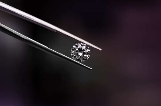 Round Diamond In Tweezers