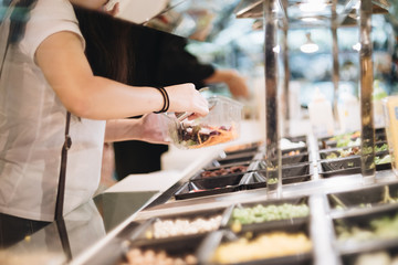 Woman hand fork over for dinner salad