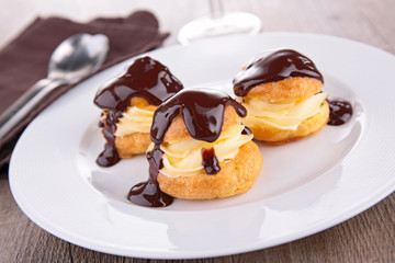 profiterole, french puff pastry with cream and chocolate