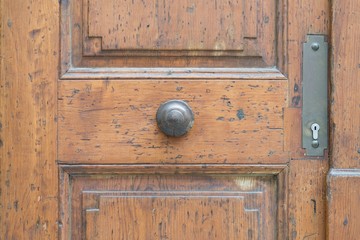Vintage door handle on a wooden front door